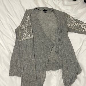 Lightweight, loose grey cardigan with arm design